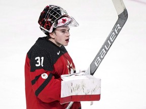 In this Jan. 4, 2017 file photo, Canadian goalie Carter Hart celebrates a win over Sweden in the world junior semifinals in Montreal.