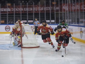 Yu Baiwei carries the puck for Kunlun Red Star in their Canadian Women's Hockey League game against Markham Thunder at the Shenzhen Universiade Sports Center in Shenzhen, China, on Nov. 22.