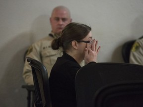 Nicole Finn, of West Des Moines, wipes the corner of her eye after the second day of testimony from Amy Sacco, a social worker for Iowa's Department of Human Services, during Finn's trial for murder, kidnapping and child endangerment on Wednesday, Dec. 6, 2017, at the Polk County Courthouse.