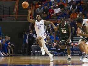 Boise State guard Marcus Dickinson chases down an errant Colorado State pass during the first half of an NCAA college basketball game Wednesday, Dec. 27, 2017, in Boise, Idaho.
