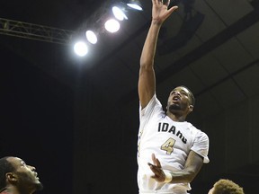 Idaho's Brayon Blake attempts a shot over Washington State's Milan Acquaah, left, and Malachi Flynn in the first half of an NCAA college basketball game in Moscow, Idaho, Wednesday, Dec. 6, 2017.