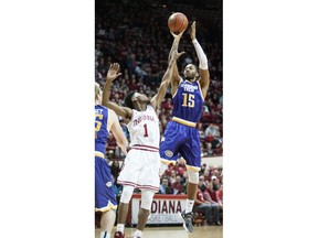 Tennessee Tech forward Curtis Phillips Jr. (15) shoots over Indiana guard Aljami Durham (1) during the first half of an NCAA college basketball game in Bloomington, Ind., Thursday, Dec. 21, 2017.