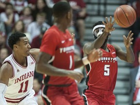 Youngstown State guard Jeremiah Ferguson (5) passes to guard Braun Hartfield (1) as Indiana guard Devonte Green (11) defends during the first half of an NCAA college basketball game in Bloomington, Ind., Friday, Dec. 29, 2017.