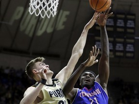 Tennessee State's Christian Mekowulu has his shot blocked by Purdue's Isaac Haas during the first half of an NCAA college basketball game, Thursday, Dec. 21, 2017, in West Lafayette, Ind.