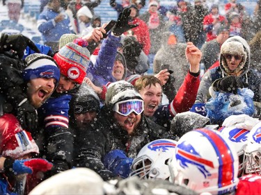 Fans celebrate the winning touchdown.