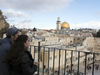 Jewish women watch the Western Wall and the golden Dome of the Rock Islamic shrine on Dec. 6, 2017 in Jerusalem.