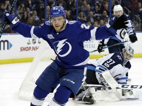 Brayden Point of the  Lightning celebrates his game-winning goal in overtime against the Winnipeg Jets on Saturday night in Tampa, Fla. The Lightning won 4-3.