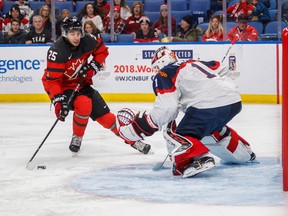 Canada's Jordan Kyrou goes to the net against Slovakia goalie David Hrenak on Dec. 27, 2017