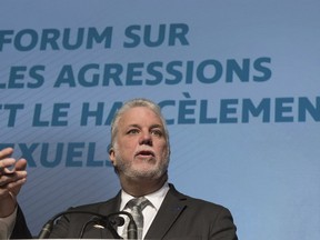 Quebec Premier Philippe Couillard speaks at the opening of a forum on sexual harassment and assaults on Thursday, December 14, 2017 in Quebec City.