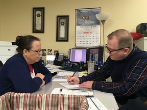 David Ermold, right, files to run for Rowan County Clerk in Kentucky as Clerk Kim Davis looks on Wednesday, Dec. 6, 2017,  in Morehead, Ky.