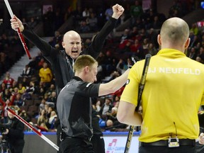 Kevin Koe of Calgary exults after drawing to the four-foot for the margin of victory in a 7-6 win over Mike McEwen's rink from Winnipeg in the men's final of the Olympic Curling Trials in Ottawa on Sunday.