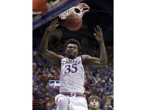 Kansas center Udoka Azubuike (35) dunks during the first half of an NCAA college basketball game against Nebraska-Omaha in Lawrence, Kan., Monday, Dec. 18, 2017.