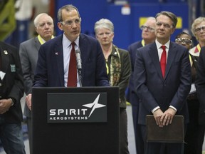 Spirit AeroSystems President and CEO Tom Gentile speaks during a news conference Wednesday, Dec. 6, 2017, in Wichita&amplt; kan., where it the company announced plans to add more than 1,000 jobs over the next two years. It also plans $1 billion in new capital investment at its Wichita site, he said. Kansas Lt. Gov. Jeff Colyer, right, looks on.