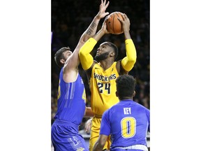 Wichita State's Shaquille Morris (24) goes up for two against South Dakota State's Ian Theisen during the first half of an NCAA college basketball game at Koch Arena in Wichita, Kan., Tuesday, Dec. 5, 2017.
