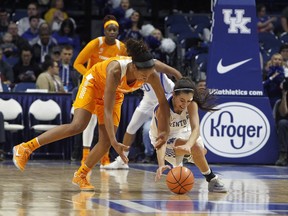 Tennessee's Jaime Nared, left, battles for the ball with Kentucky's Maci Morris during an NCAA college basketball game in Lexington, Ky., Sunday, Dec. 31, 2017.