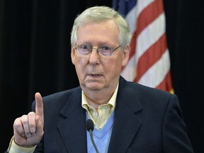 Senate Majority Leader Mitch McConnell, R-Ky., answers a reporters question during a news conference Saturday, Dec. 2, 2017, in Louisville, Ky. The Senate passed the tax bill early Saturday morning with a 51-49 vote.