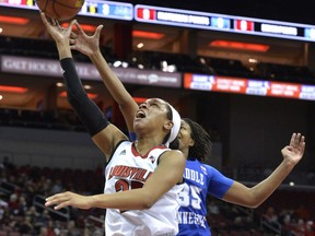 Louisville guard Asia Durr (25) shoots ahead of the defense of Middle Tennessee forward Charity Savage (35) during the first half of an NCAA college basketball game Saturday, Dec. 9, 2017, in Louisville, Ky.