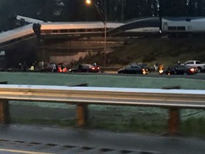 This photo provided by Danae Orlob shows an Amtrak train that derailed south of Seattle on Monday, Dec. 18, 2017. Authorities reported "injuries and casualties." The train derailed about 40 miles (64 kilometers) south of Seattle before 8 a.m., spilling at least one train car on to busy Interstate 5.