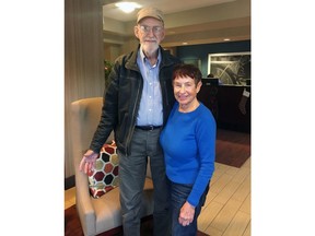 In this Monday, Dec. 18, 2017 photo provided by Curry Sawyer, Ray and Curry Sawyer pose at a hotel where they're staying in Goleta, Calif. The Sawyers have been away from their home for 11 days because of a massive wildfire and may not be allowed back before Christmas, when both their sons and their families were supposed to celebrate the holidays. (Curry Sawyer via AP)