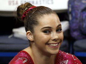 FILE - In this Aug. 17, 2013 file photo McKayla Maroney smiles after competing on the floor exercise during the U.S. women's national gymnastics championships in Hartford, Conn. Maroney says the group that trains U.S. Olympic gymnasts forced her to sign a confidential settlement to keep allegations of sexual abuse by the team's doctor secret. Maroney filed a lawsuit Wednesday, Dec. 20, 2017, in Los Angeles, against the United States Olympic Committee and USA Gymnastics. The suit also seeks damages from Michigan State University, where the team's doctor, Larry Nassar, worked for decades.