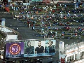 FILE - In this Oct. 3, 2017 file photo, personal belongings and debris litters the Route 91 Harvest festival grounds across the street from the Mandalay Bay resort and casino in Las Vegas. Attorneys for a California woman wounded in the Oct. 1 mass shooting that killed 58 and left hundreds injured on the Las Vegas Strip have dropped a gun accessories maker from her negligence and damages lawsuit. One of Rachel Sheppard's lawyers, Craig Eiland, said Thursday, Dec. 7, 2017,  the decision to strip Slide Fire Solutions from the case lets him focus claims against hotel owner MGM Resorts International and concert promoter Live Nation Entertainment.