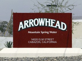 FILE - In this July, 7, 2004, file photo, a sign at the entrance to the Arrowhead Mountain Spring Water Company bottling plant, owned by Swiss conglomerate Nestle, on the Morongo Indian Reservation near Cabazon, Calif. Nestle, which sells Arrowhead bottled water, may have to stop taking millions of gallons of water from Southern California's San Bernardino National Forest because state regulators concluded it lacks valid permits. The State Water Resources Control Board notified the company on Wednesday, Dec. 20, 2017, that an investigation concluded it doesn't have proper rights to pipe about three-quarters of the water it currently withdraws for bottling.