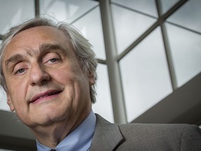 FILE - In this July 24, 2014, file photo, then-Chief Judge of the U.S. Court of Appeals for the Ninth Circuit Alex Kozinski poses for a portrait in the lobby of a Washington office building. The Washington Post says nine more women say they were subject to inappropriate sexual conduct or comments by a prominent U.S. appeals court judge. In a story published on Friday, Dec. 15, 2017, the newspaper says the latest allegations against 9th U.S. Circuit Court of Appeals Judge Kozinski go back decades and include women who met him at events.