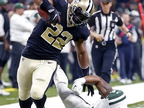New Orleans Saints running back Mark Ingram (22) tries to get past New York Jets inside linebacker Darron Lee (58) on a 54-yard pass play in the first half of an NFL football game in New Orleans, Sunday, Dec. 17, 2017.