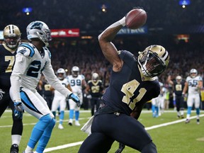New Orleans Saints running back Alvin Kamara (41) his touchdown front of Carolina Panthers cornerback James Bradberry (24) in the first half of an NFL football game in New Orleans, Sunday, Dec. 3, 2017.