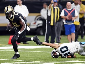 New Orleans Saints running back Alvin Kamara (41) breaks loose from Carolina Panthers free safety Kurt Coleman (20) on a touchdown carry in the second half of an NFL football game in New Orleans, Sunday, Dec. 3, 2017.