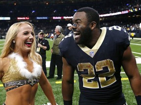 New Orleans Saints running back Mark Ingram (22) dances with cheerleaders after an NFL football game against the Atlanta Falcons in New Orleans, Sunday, Dec. 24, 2017. The Saints won 23-13, clinching a playoff berth.