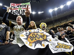 New Orleans Saints fans celebrate after an NFL football game against the Atlanta Falcons in New Orleans, Sunday, Dec. 24, 2017. the Saints won 23-13, clinching a playoff berth.