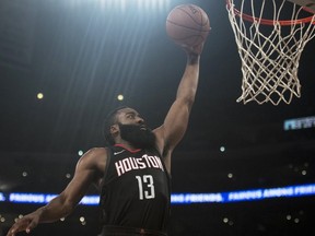 Houston Rockets guard James Harden goes up for a dunk during the first half of an NBA basketball game against the Los Angeles Lakers on Sunday, Dec. 3, 2017, in Los Angeles.