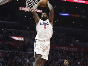 Los Angeles Clippers' DeAndre Jordan goes up for a dunk during the first half of an NBA basketball game against the Toronto Raptors Monday, Dec. 11, 2017, in Los Angeles.