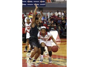 Nicholls State's Tia Charles (3) tries to dribble around Baylor's Moon Ursin (12) in an NCAA college basketball game in Thibodaux, La., Monday, Dec. 18, 2017.