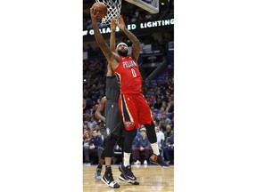 New Orleans Pelicans center DeMarcus Cousins (0) shoots over Brooklyn Nets center Jarrett Allen (31) in the first half of an NBA basketball game in New Orleans, Wednesday, Dec. 27, 2017.