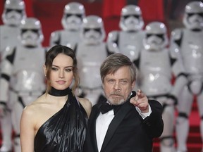 Actors Daisy Ridley, left, and Mark Hamill pose for photographers upon arrival at the premiere of the film 'Star Wars: The Last Jedi' in London, Tuesday, Dec. 12th, 2017.