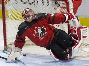 Canadian goalie Carter Hart makes a save against the Czech Republic in London, Ont., on Dec. 20.