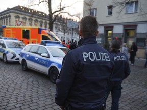 Police close the streets around a Christmas market after a suspicious object was found in Potsdam, eastern Germany, Friday, Dec. 1, 2017. ( Julian Staehle/dpa via AP)