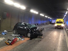 In this photo provided by the Cantonal police Uri the accident site is pictured after a collision between a car and a truck in the Gotthard tunnel near the village of Hospental, Switzerland, Wednesday, Dec. 13, 2017. Two people where killed and four injured.