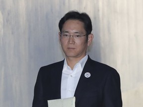 Lee Jae-yong, vice chairman of Samsung Electronics, arrives at the Seoul Central District Court in Seoul, South Korea, Wednesday, Dec. 27, 2017. Prosecutors are demanding a 12-year prison term for Lee for his conviction on bribery and other charge