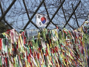 South Korea's national flag flutters in the wind at the Imjingak Pavilion in Paju, South Korea, Monday, Dec. 11, 2017. South Korea added several North Korean groups and individuals to its sanctions list Monday in a largely symbolic move that is part of efforts to cut off funding for the North's weapons programs.