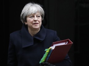 Britain's Prime Minister Theresa May leaves 10 Downing Street to attend the weekly session of Prime Ministers Questions in Parliament in London, Wednesday, Dec. 6, 2017.