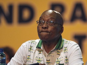 FILE - In this Monday, Dec. 18, 2017 file photo, outgoing ANC president and South African President Jacob Zuma, looks on after the newly elected African National Congress (ANC) President Cyril Ramaphosa, was announced president at the elective conference in Johannesburg. South Africa's top court has ruled that parliament failed to hold President Jacob Zuma accountable in a scandal over multi-million-dollar upgrades to his private home. The decision is likely to escalate pressure on Zuma to resign.