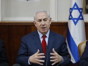 Israeli Prime Minister Benjamin Netanyahu attends the weekly cabinet meeting at his office in Jerusalem, Israel, Sunday Dec. 17, 2017.