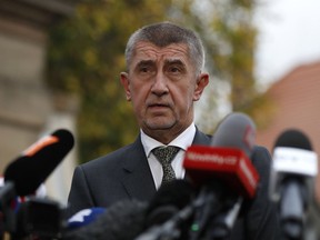 FILE - In this Monday, Oct. 23, 2017 file photo, Czech billionaire and leader of ANO 2011 political movement Andrej Babis addresses the media after meeting with Czech Republic's President Milos Zeman at the Lany Castle following the Czech Republic's parliamentary elections in Lany, Czech Republic. Czech President Milos Zeman has sworn in a new minority government led by a populist billionaire Andrej Babis after his centrist movement won landslide parliamentary elections.