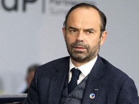 FILE - In this Friday, Nov. 24, 2017 file photo, French Prime Minister Edouard Philippe arrives for an Eastern Partnership Summit in Brussels. French Prime Minister Edouard Philippe says he will "assume responsibility" for spending 350,000 euros ($414,000) on a private flight back from a French territory in the South Pacific.