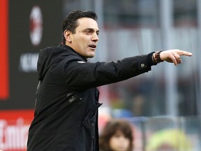 FILE - In this Nov. 26, 2017 file photo, AC Milan coach Vincenzo Montella gives instructions to his players during the Serie A soccer match between AC Milan and Torino at the San Siro stadium in Milan, Italy. Sevilla is hiring Vincenzo Montella as coach, a month after the Italian was fired by AC Milan.