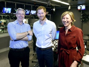 In this BBC handout photograph released on Wednesday, Dec. 27, 2017, Britain's Prince Harry, centre, poses for a photo with presenters Justin Webb and Sarah Montague in the studio for the Radio 4 Today programme which he has guest edited, in London.