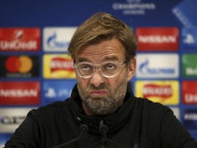 Liverpool manager Jurgen Klopp looks on during a press conference at Anfield, Liverpool, England, Tuesday, Dec. 5, 2017. Liverpool will play a Champions League Group E soccer match against Spartak Moscow on Wednesday.